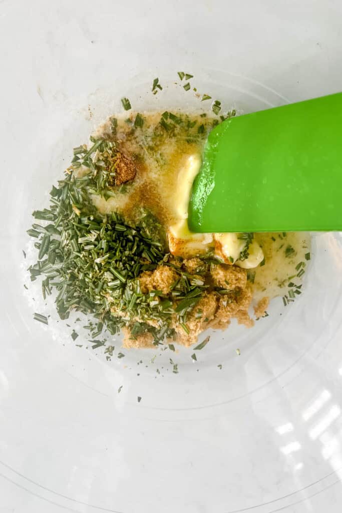 Rosemary mixed with butter, brown sugar, salt, and cayenne. 