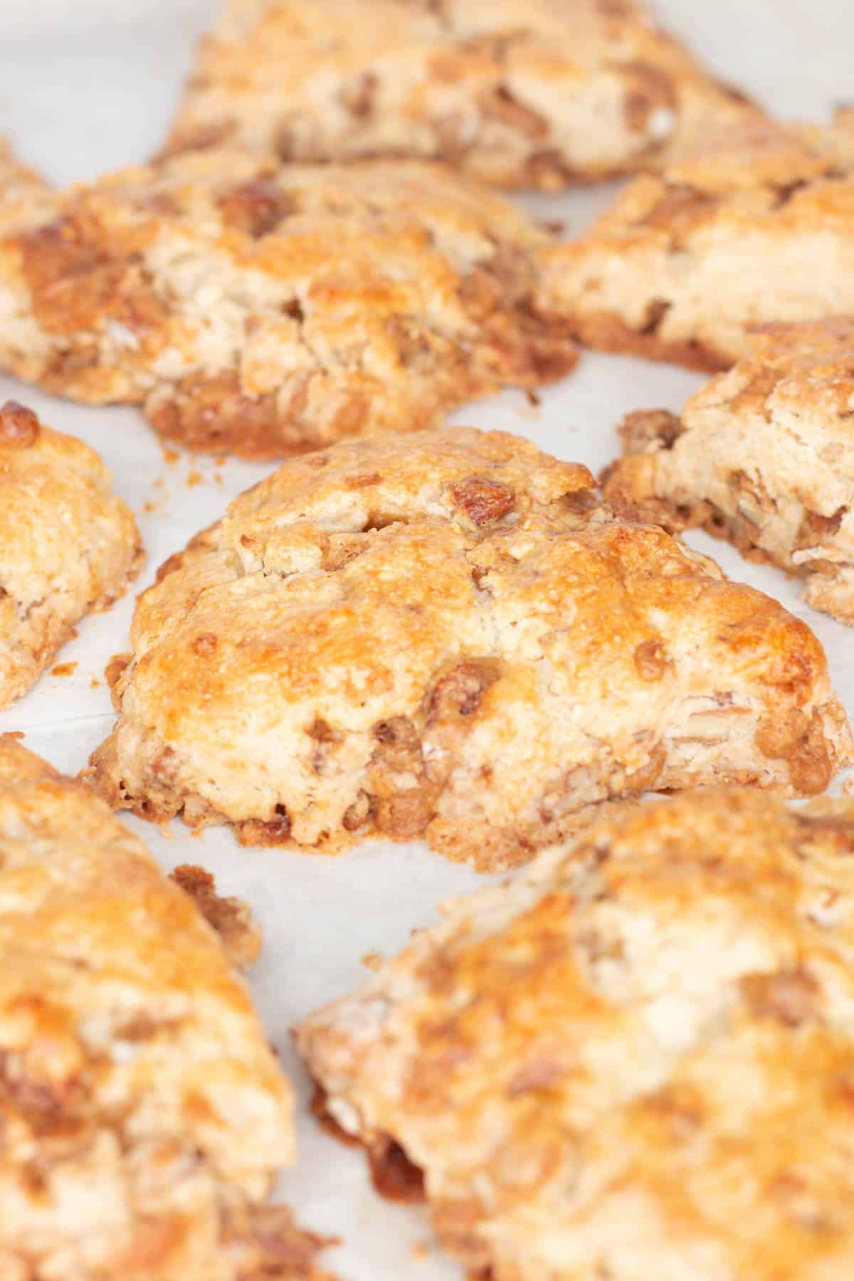 Praline pecan scones on a baking sheet. 