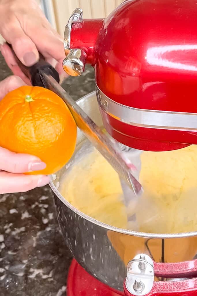 Adding orange zest and vanilla to the cookie dough. 