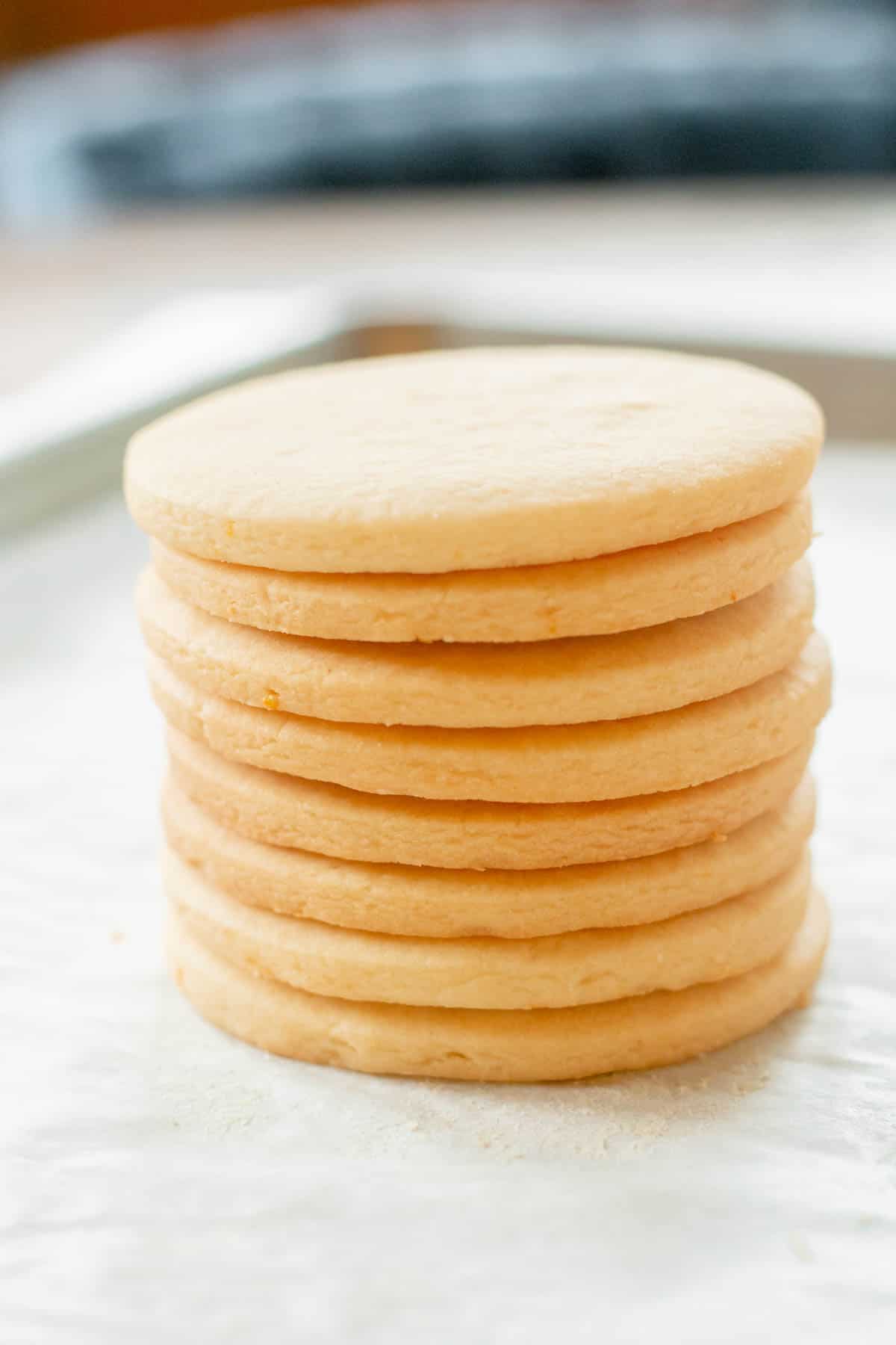 Vanilla orange sugar cookies in a stack. 