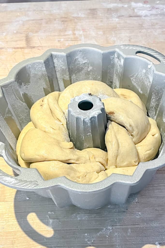Braided dough placed in the Bundt pan. 
