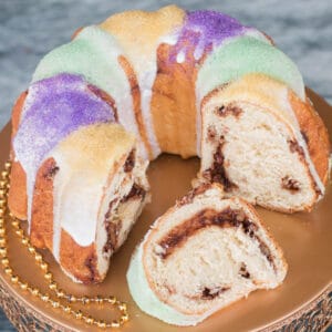 King cake bundt on a gold cake stand.