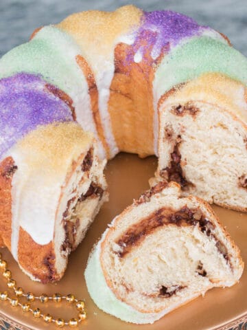 King cake bundt on a gold cake stand.