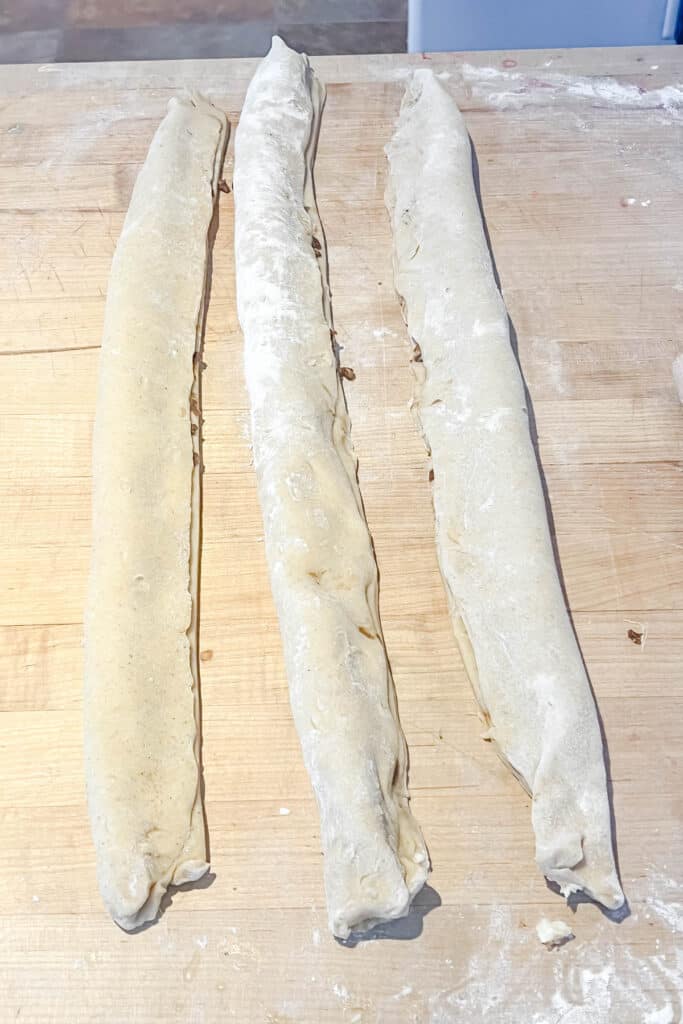 Filled dough strips folded over. 