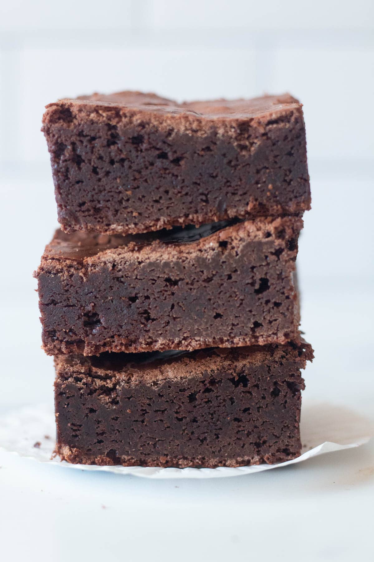 Rich and fudgy chocolate brownies, stacked.