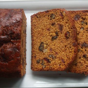 Sliced pumpkin spice bread with cranberries, dates and walnuts.