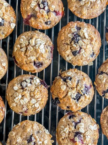 Whole Wheat Blueberry & Banana Muffins on a cooling rack