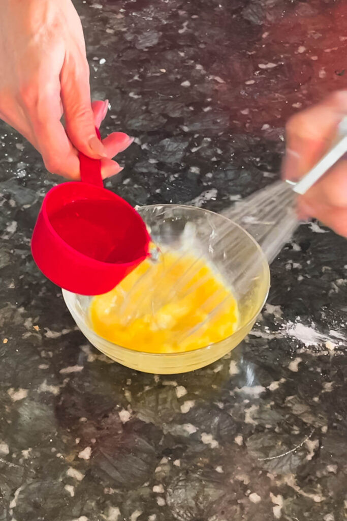 Mixing wet ingredients for pie crust dough. 
