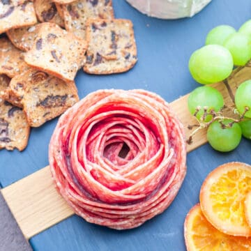 Salami rose on a charcuterie board.