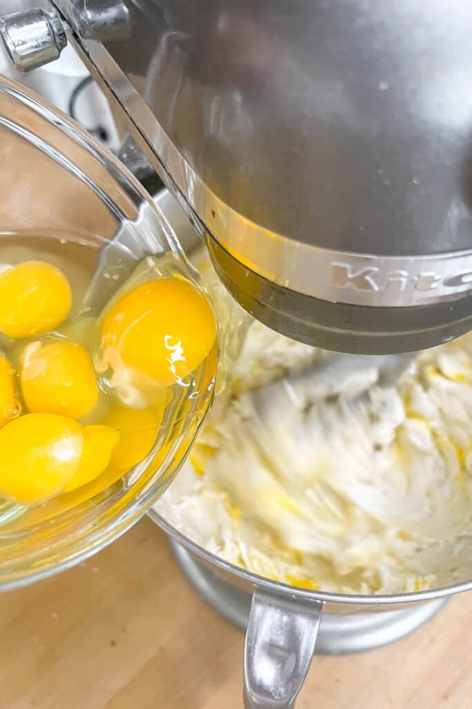 Adding eggs to butter mixture.