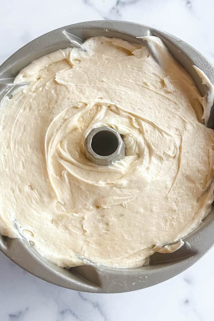 Placing batter in Bundt pan. 