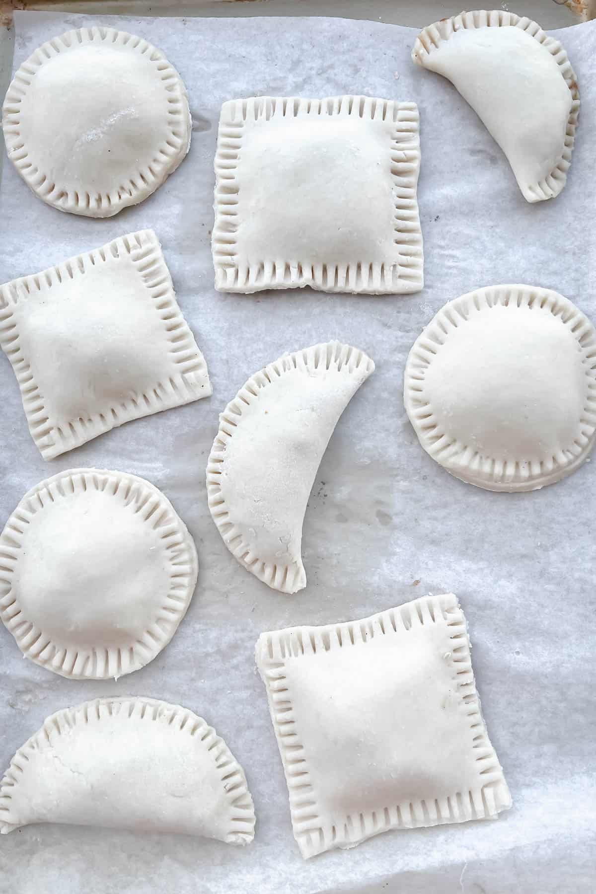 Different shapes of hand pies: circles, squares and semicircles. 