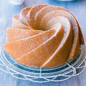 Old fashioned pound cake on a cake stand.
