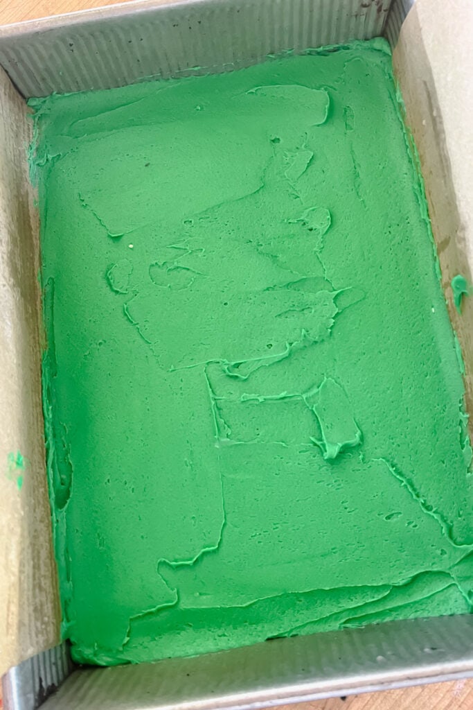 Green batter spread into the prepared pan. 