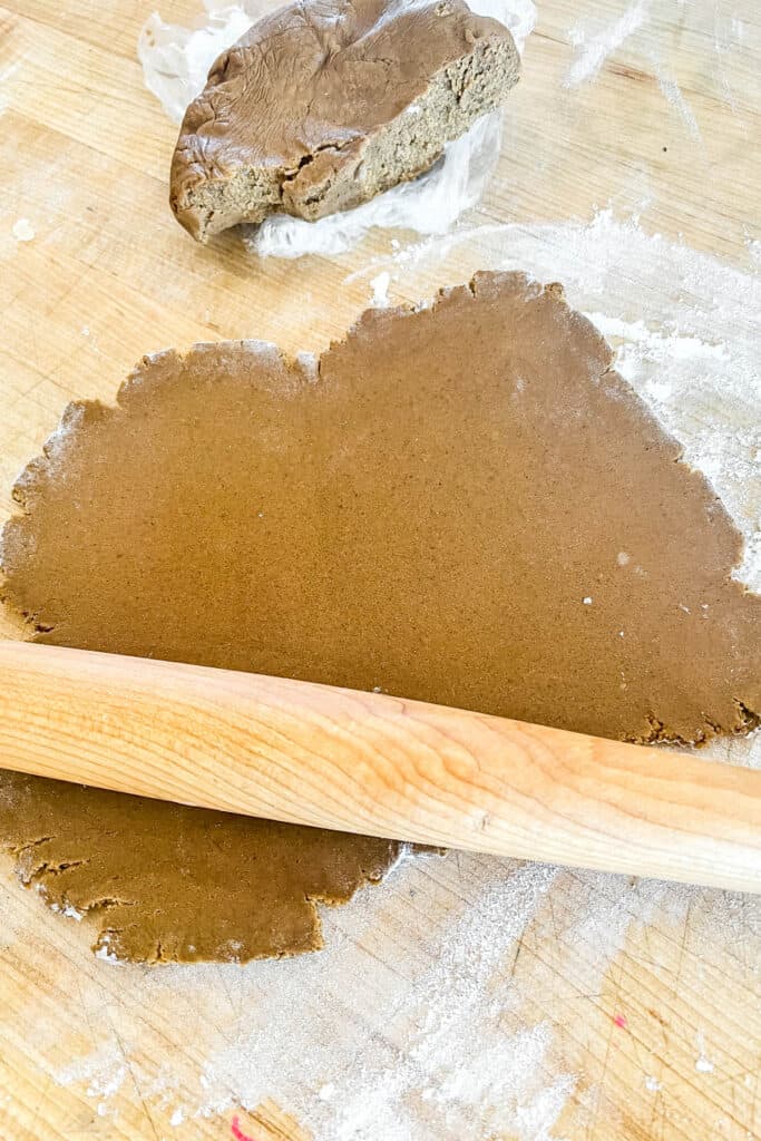 Rolling out gingerbread cookie dough. 