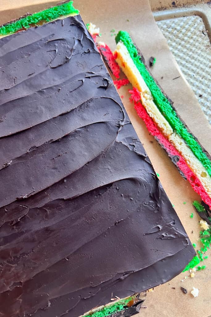 Trimming edges of the rainbow cookies. 